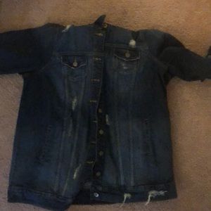 Torrid Medium Wash long Denim Trucker Jacket.